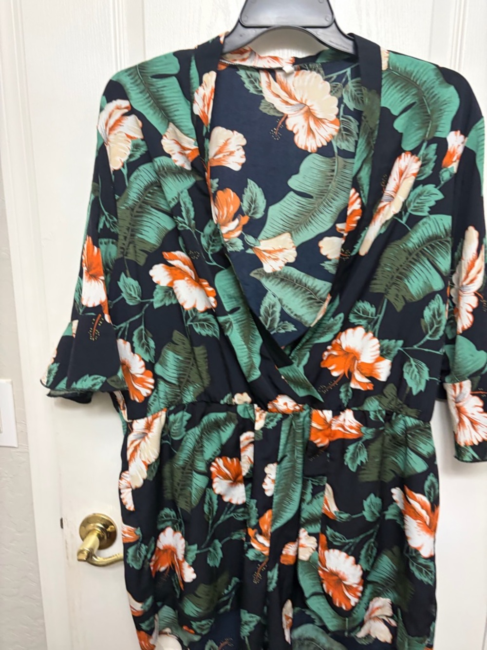 Tropical Floral Wrap Romper in Black and Green with Orange Blooms